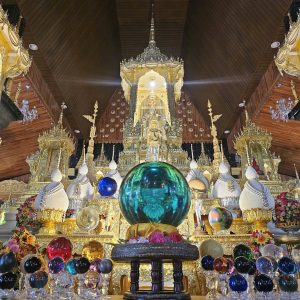 The richly decorated interior of Phra That Nong No