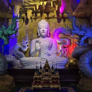 Buddha image surrounded by Naga sculptures